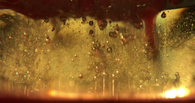Abstract bronze paint. Shooting on a yelow background