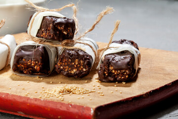 
Vegan desserts cocoa chocolate bars with amaranth grains. Plant based nutrition concept.