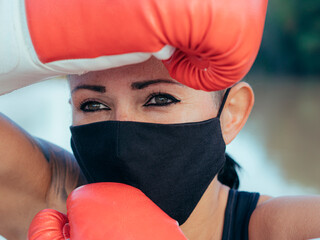 Boxer wearing boxing gloves and face mask