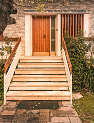marble stairs to family house entrance natural wood door with transom window - obrazy, fototapety, plakaty