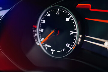 Fototapeta premium Modern car close up view of tachometer and dashboard with backlight