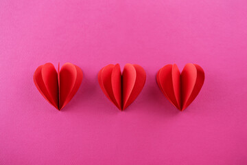 Pink background with red pepper hearts for Valentine's day