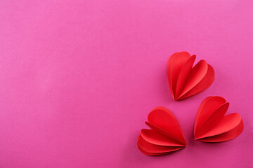 Pink background with red pepper hearts for Valentine's day