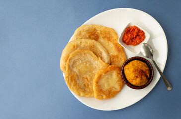 
National oriental and Asian cuisine. Fried tortillas with curry sauces and red hot peppers.