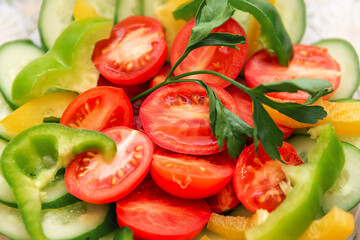 salad, tomatoes, peppers in a plate. Sliced vegetables, bright colors.