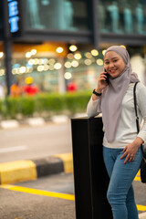 Young teenager waiting vehicle at stop station.