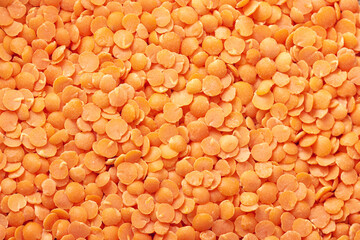 Close-up of red lentil background. Abstract food texture.