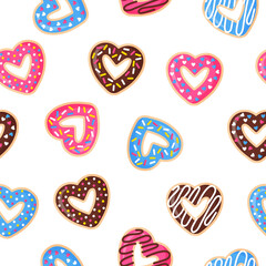 Seamless pattern with heart shaped donuts with pink, blue and chocolate icing.