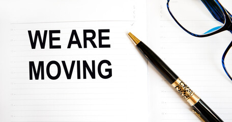 In the diary text We Are Moving, next to the pen, glasses.