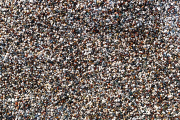 Multi-colored pebbles on the beach 