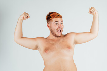 Young man with chest bare, flexing muscles