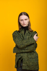 Androgen. Androgynous character on a yellow background. Man or woman. Military style.