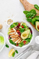 Foto op Plexiglas Grilled chicken meat and fresh vegetable salad of tomato, avocado, lettuce and spinach. Healthy and detox food concept. Ketogenic diet. Buddha bowl dish on white background, top view © Sea Wave
