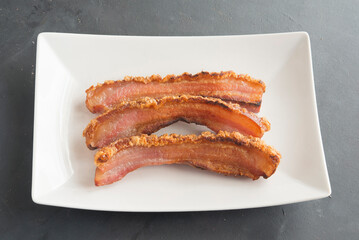 slice of bacon on plate