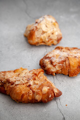 Fresh baked croissants on cement background.