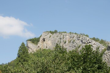 Fototapeta na wymiar a cross on the hill in Svaty Jan pod Skalou, Czech Republic