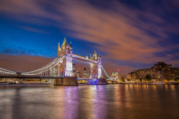 Tower Bridge with dramatic sky at night in London, England, UK