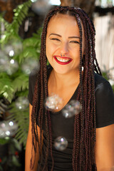 Happy girl, beautiful happy girl and soap bubbles with natural light, selective focus.