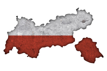 Karte und Fahne von Tirol auf verwittertem Beton
