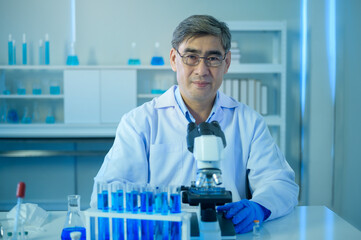 Fototapeta premium Portrait of scientist during experiment in laboratory, Science and technology healthcare concept