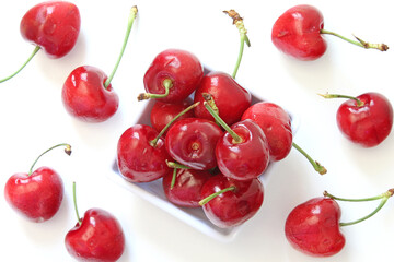 Portion of cherries on white background