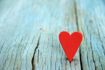 Naklejka na ściany i meble Love heart on wooden texture background. Valentine's day concept. Heart for Valentines Day Background.