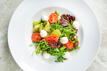 fresh salad with mozzarella and vegetables