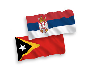Flags of East Timor and Serbia on a white background