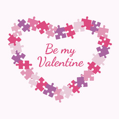 Valentine's Day holiday. Heart made from puzzle pieces on a light pink background. Inscription be my valentine