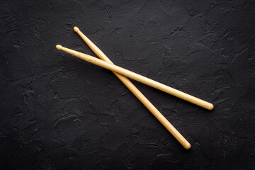 Two wooden drum sticks, top view. Music background