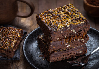 Dark Chocolate Brownies Stacked on a Plate