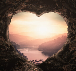 Fototapeta Heart shape of cave on river and mountains sunset background obraz