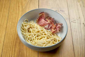 Italian pasta (spaghetti) with smoked cream and bacon. Carbonara paste. Italian Cuisine
