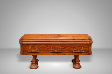 luxury wood coffin on a grey set