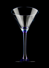 The martini glass is isolated on a black background.