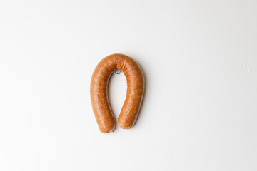 Horseshoe for happiness is made from sausage
