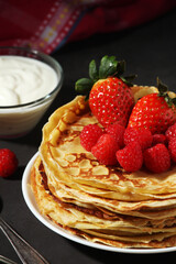 Russian cuisine national dish bliny with fresh berries