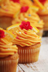 Cupcakes with orange icing on top