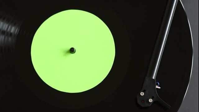 Turntable playing vinyl LP record top view. Party, leisure, music, hobby, enjoying life, having fun, technology concept