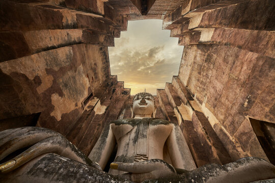 Giant buddha sculpture in stupa at wat sri chum sukhothai