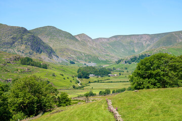 Fototapeta na wymiar The valley near Kentmere with the summits of Yoke, Ill Bell, Fro