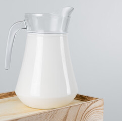 A jug of  fresh milk glass on wooden crate box..Raw milk is high in calcium and protein to drink for all ages..Milk consumption nutritious and healthy dairy products concept.