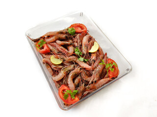 Fresh Rose Shrimp or Pink Shrimp decorated with vegetables and fruits on a glass bowl.Selective focus.