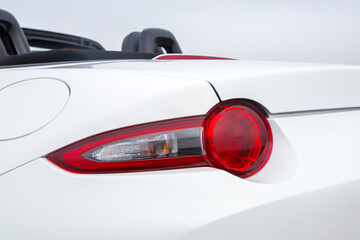 Close-up  car rear tail-lamp with a brakelight stop signal.