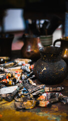 rustic used art tools on a table