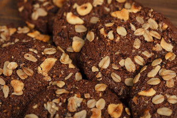 delicious homemade healthy cookies. oatmeal and nut cookies. on wooden background.
