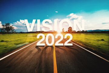 2022 written on highway road in the middle of empty asphalt road and beautiful blue sky. Concept...