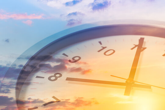 Clock face overlay with beautiful sunrise sky for good times working morning a new day concept.
