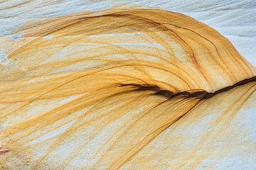The beach Teluk Assam in the Bako National Park features many spectacular rock formations caused by erosion and exhibiting colorful layers showing how it was formed