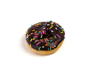 Chocolate flavoured donut with sprinkles on white background. One black doughnut isolated picture. Homemade bakery concept.